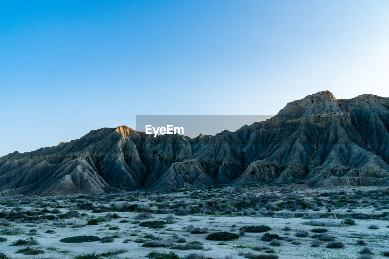 SCENIC VIEW OF MOUNTAIN AGAINST SKY