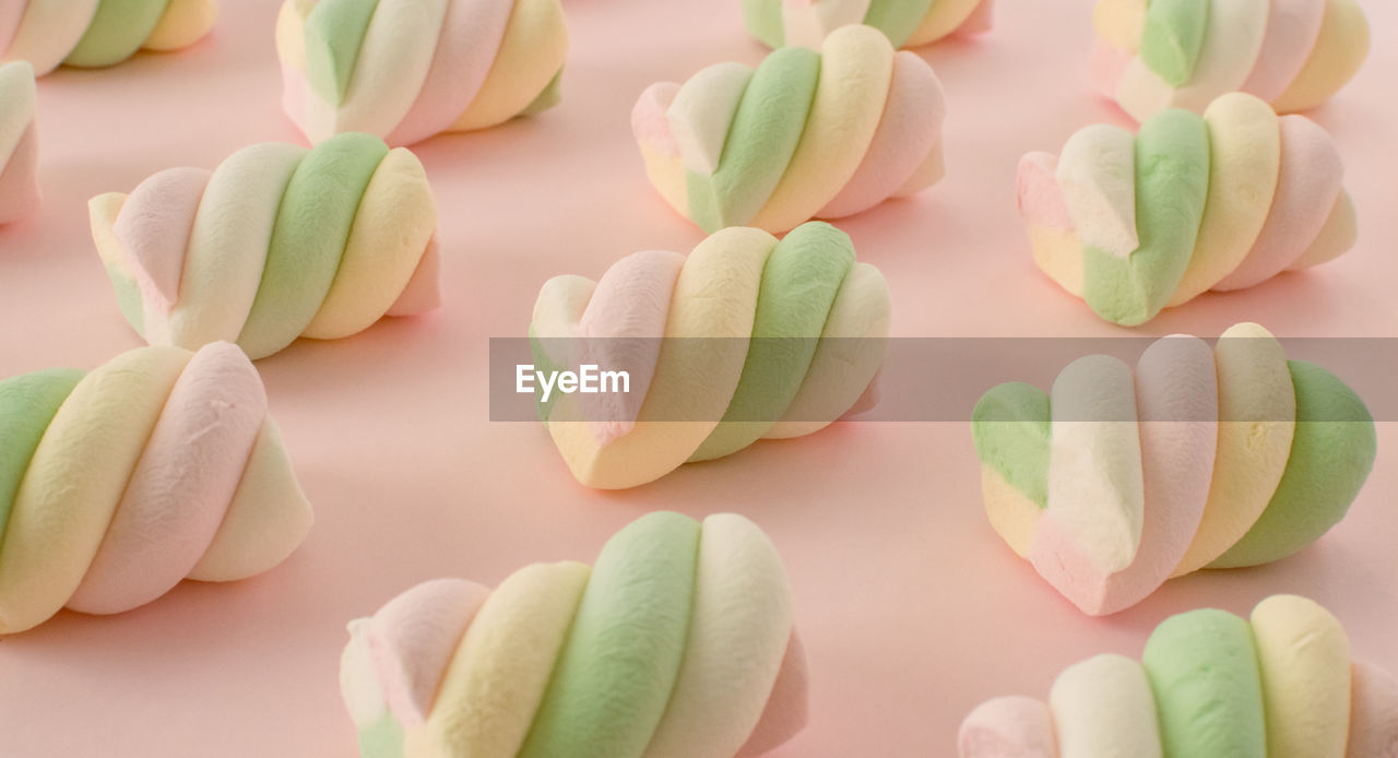 pink, icing, food, food and drink, sugar paste, dessert, flower, petal, sweet food, sweet, no people, cake decorating, freshness, large group of objects, green, multi colored, cake, indoors, pastel colored, candy, still life, plant, temptation, close-up