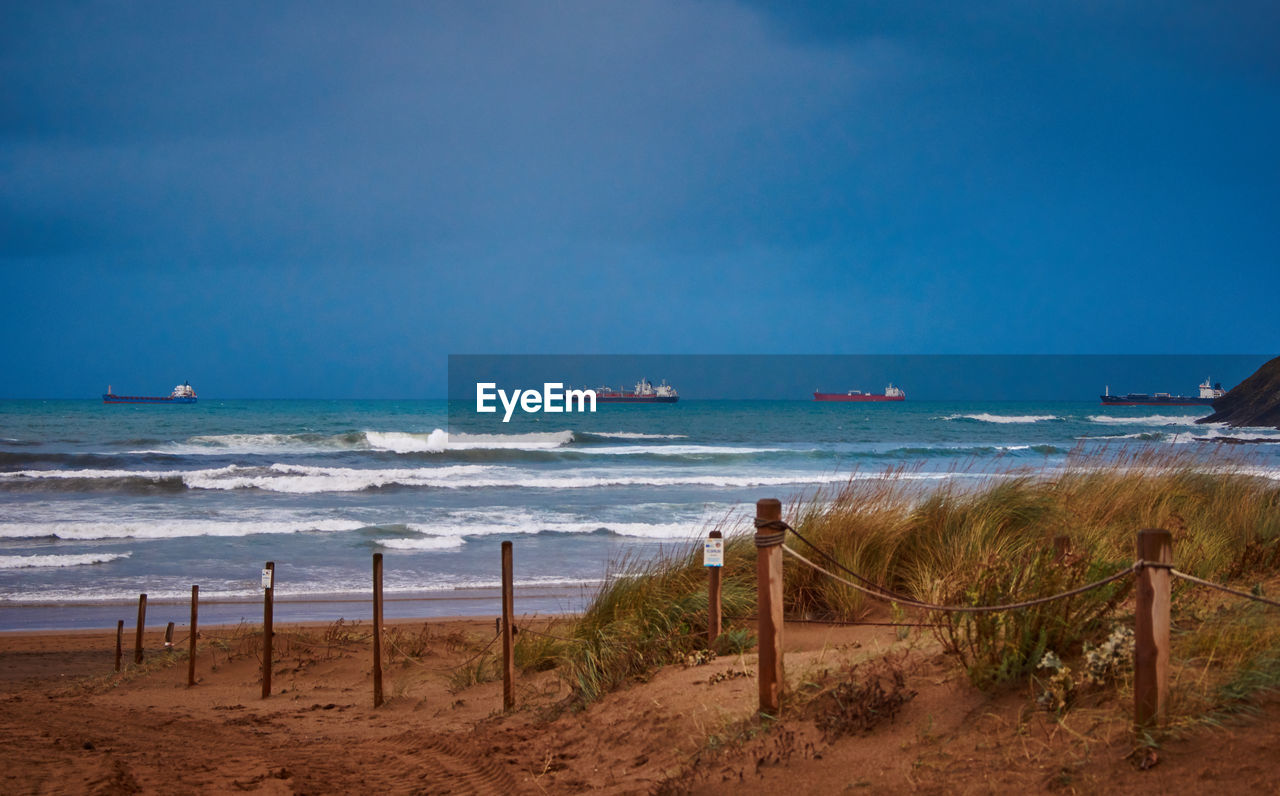 SCENIC VIEW OF BEACH AND SEA AGAINST SKY