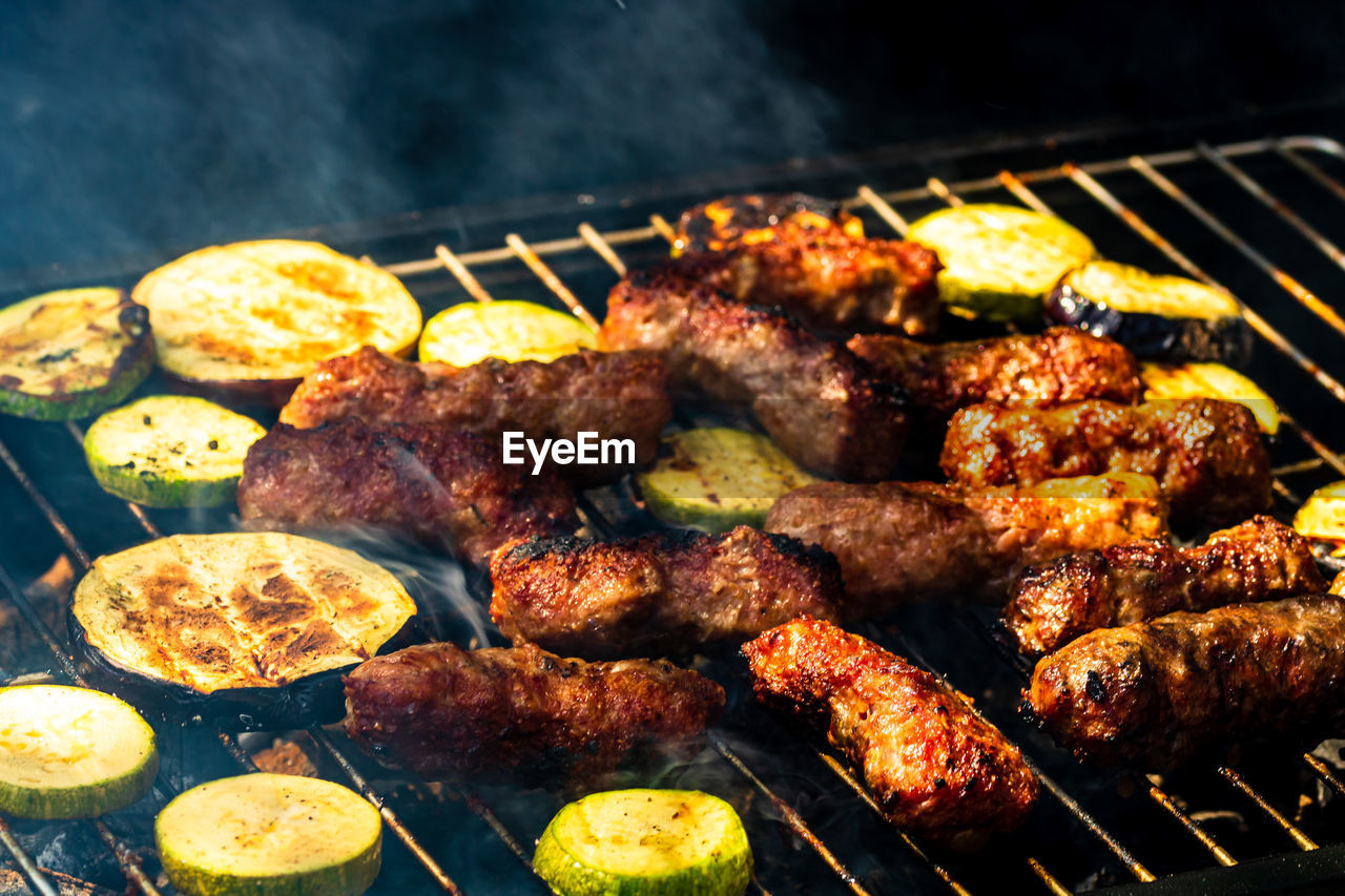HIGH ANGLE VIEW OF MEAT ON BARBECUE