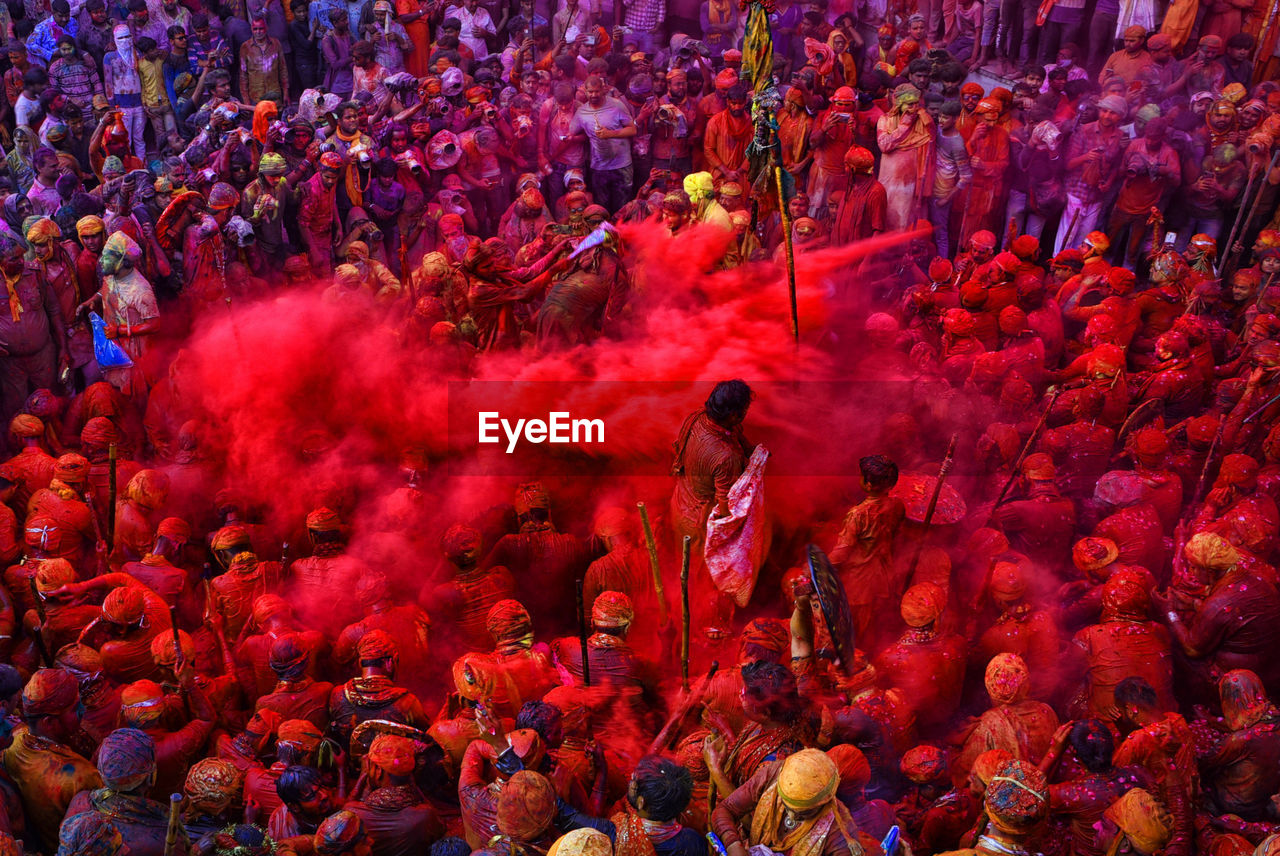 Hindu devotees play with colorful powdersat the radharani temple of nandgaon 