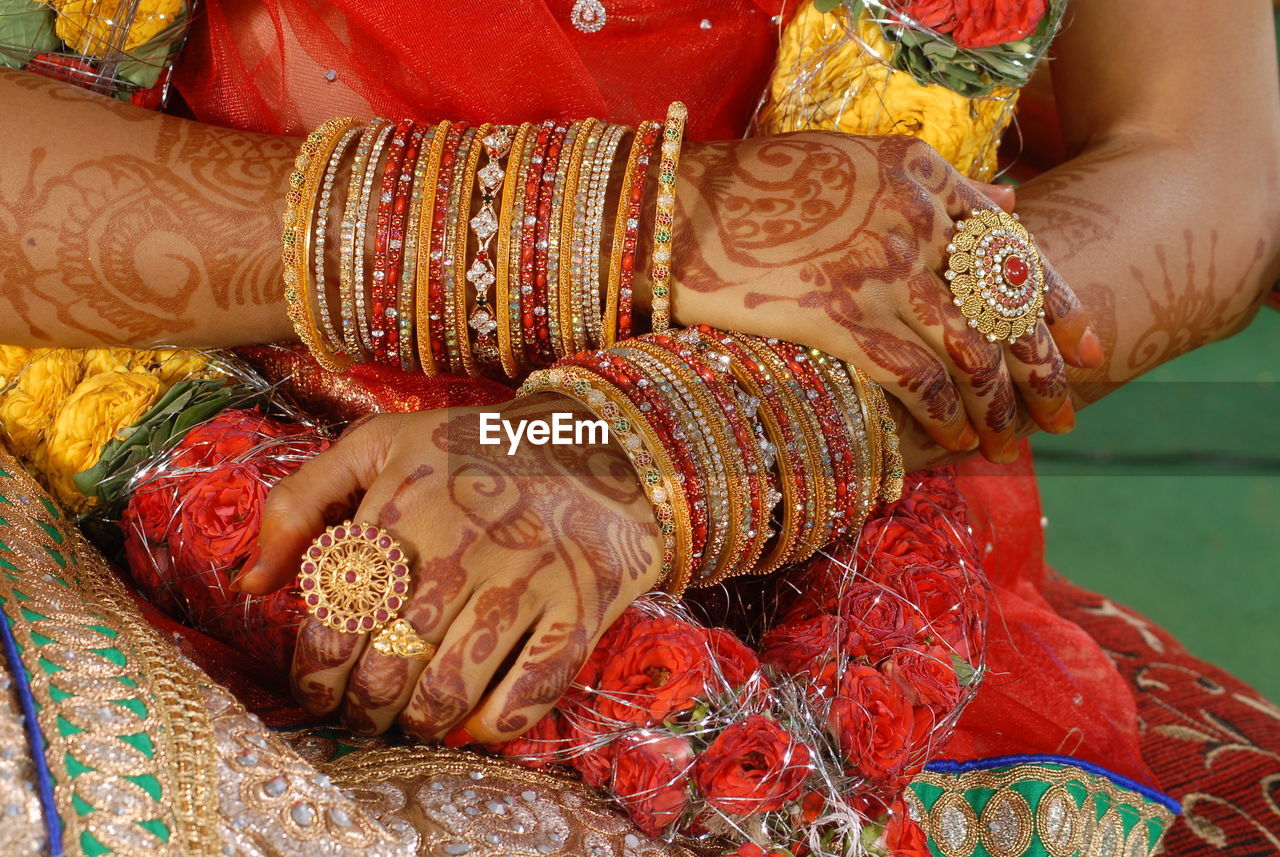 Midsection of bride at wedding ceremony