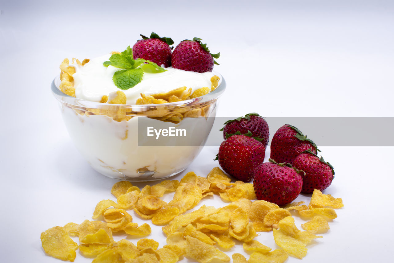 Close-up of breakfast against white background