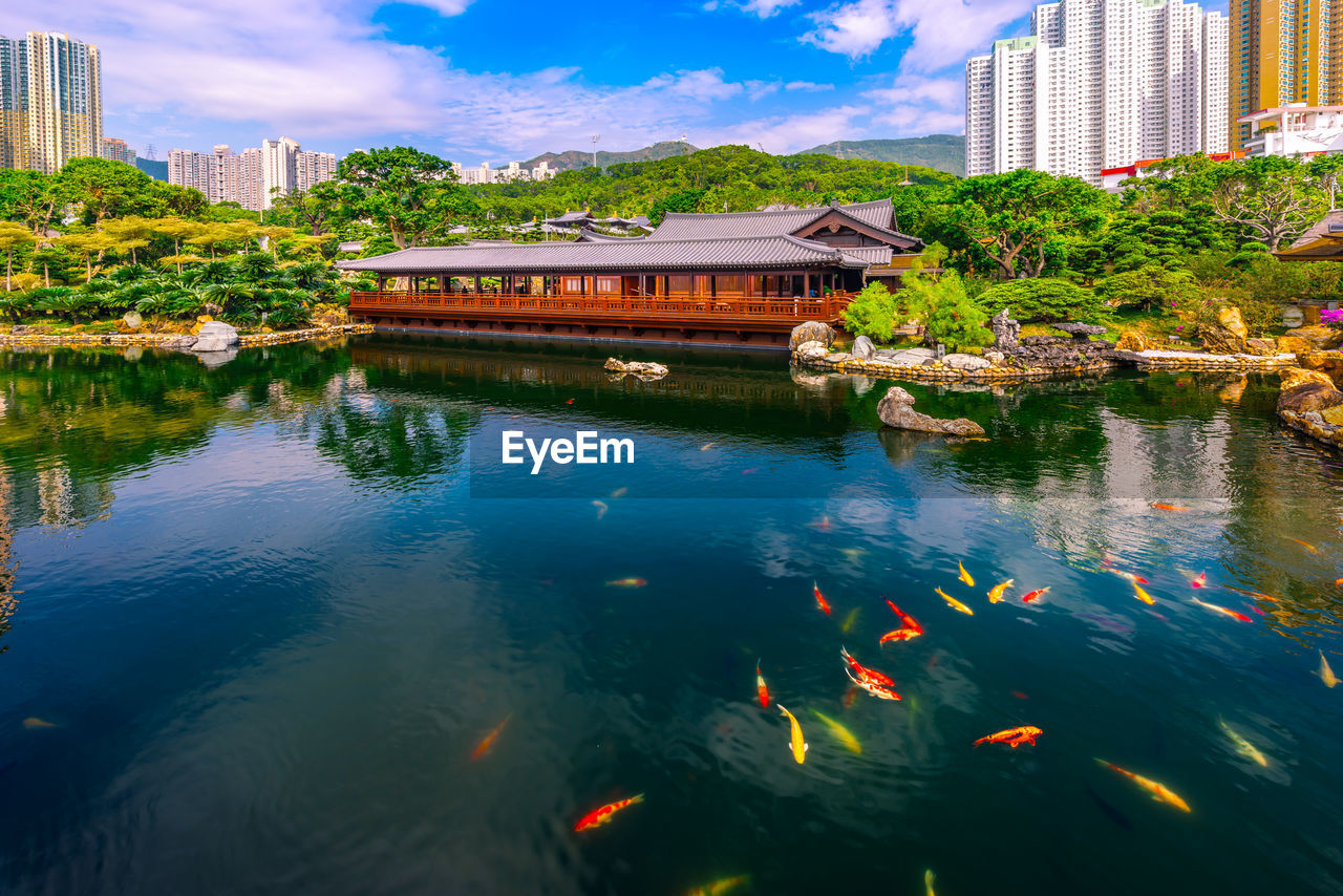 SCENIC VIEW OF LAKE AGAINST BUILDINGS