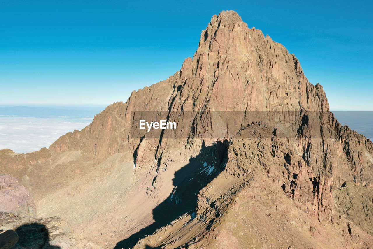 Mount kenya's highest peak, batian peak above the clouds at mount kenya