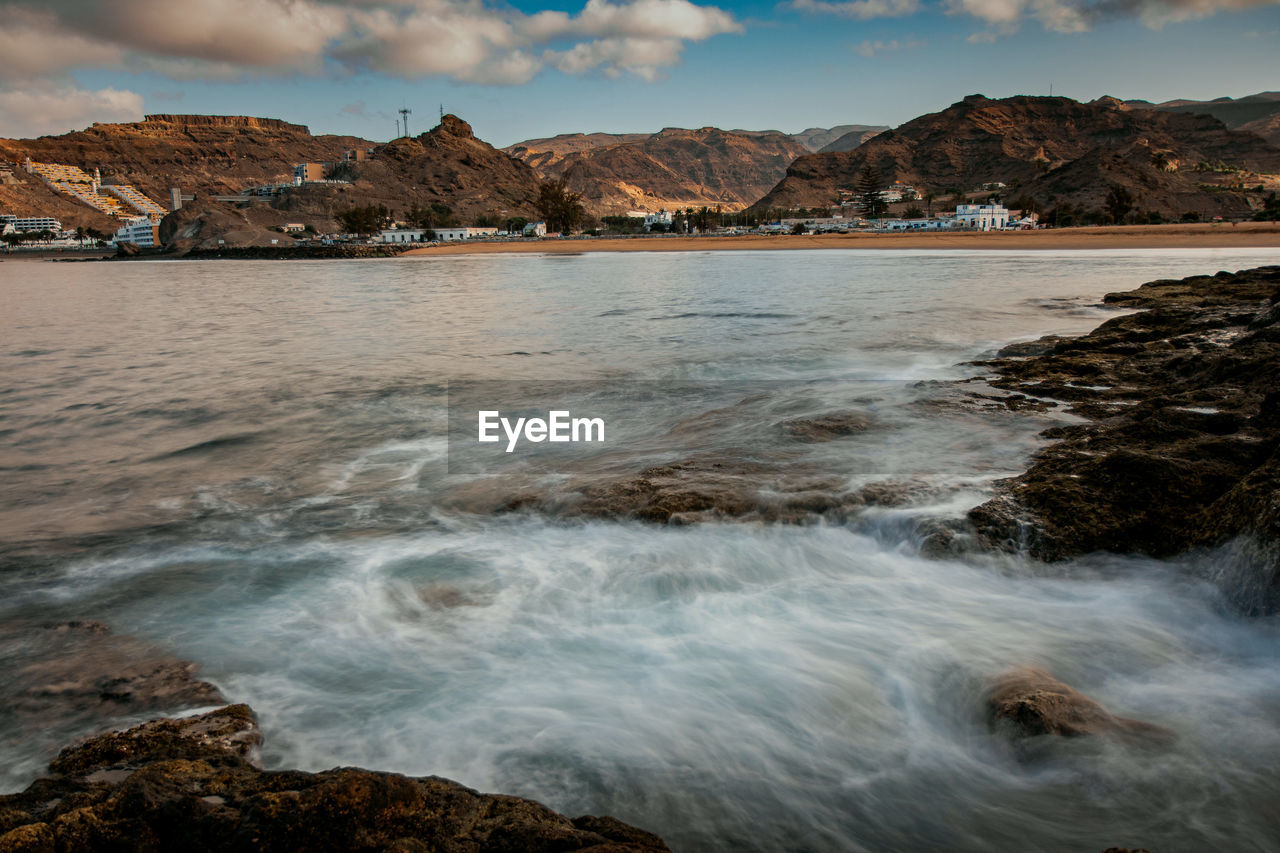 SCENIC VIEW OF SEA AND ROCKS