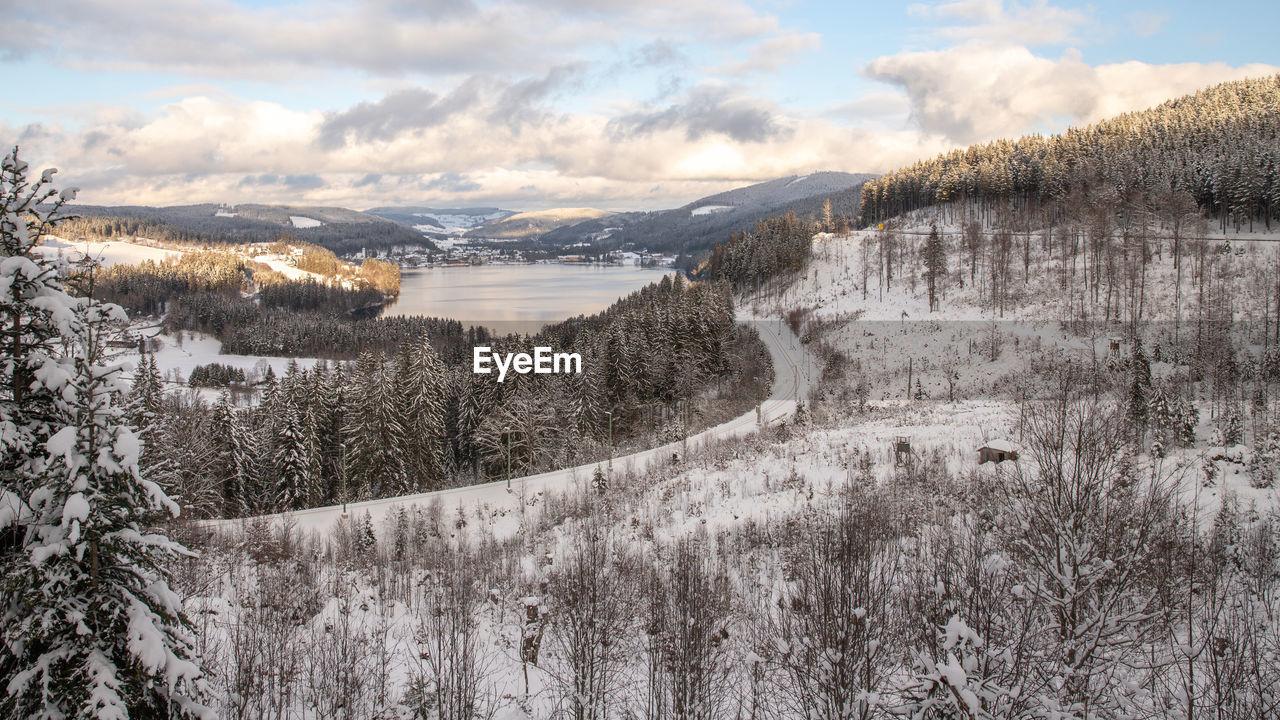 SNOW COVERED LANDSCAPE AGAINST SKY