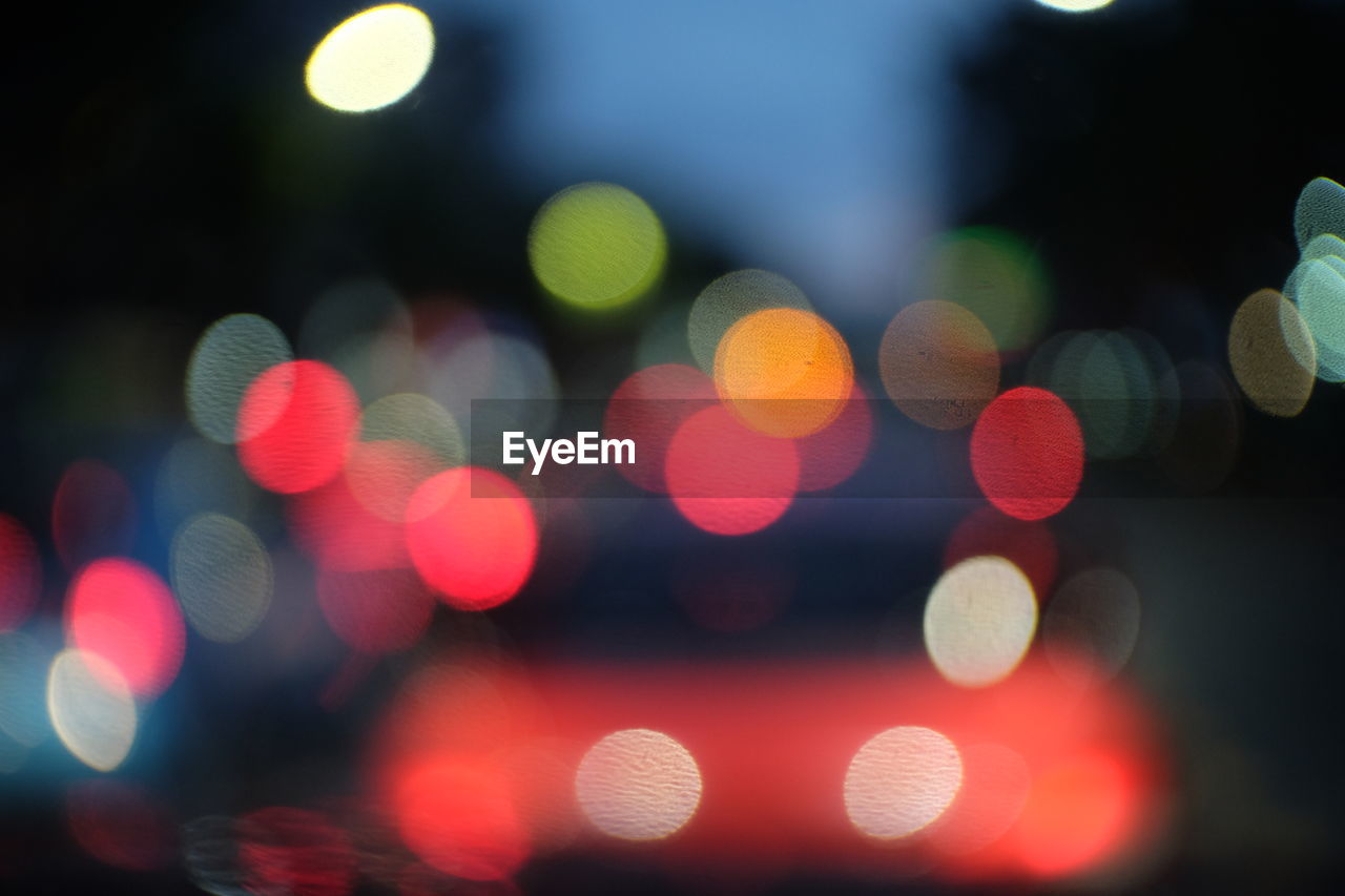 Defocused image of colorful illuminated lights at night