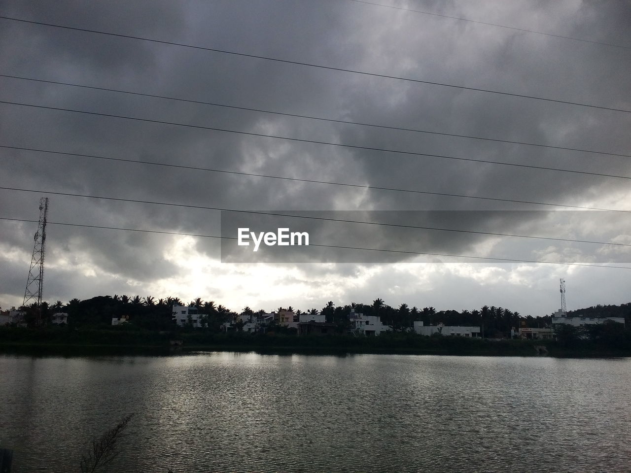 VIEW OF CALM SEA AGAINST CLOUDY SKY