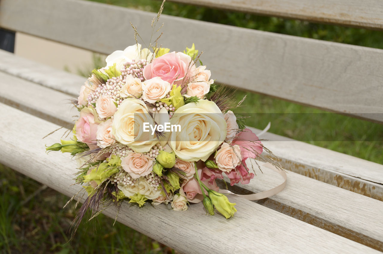 Close-up of bouquet on bench