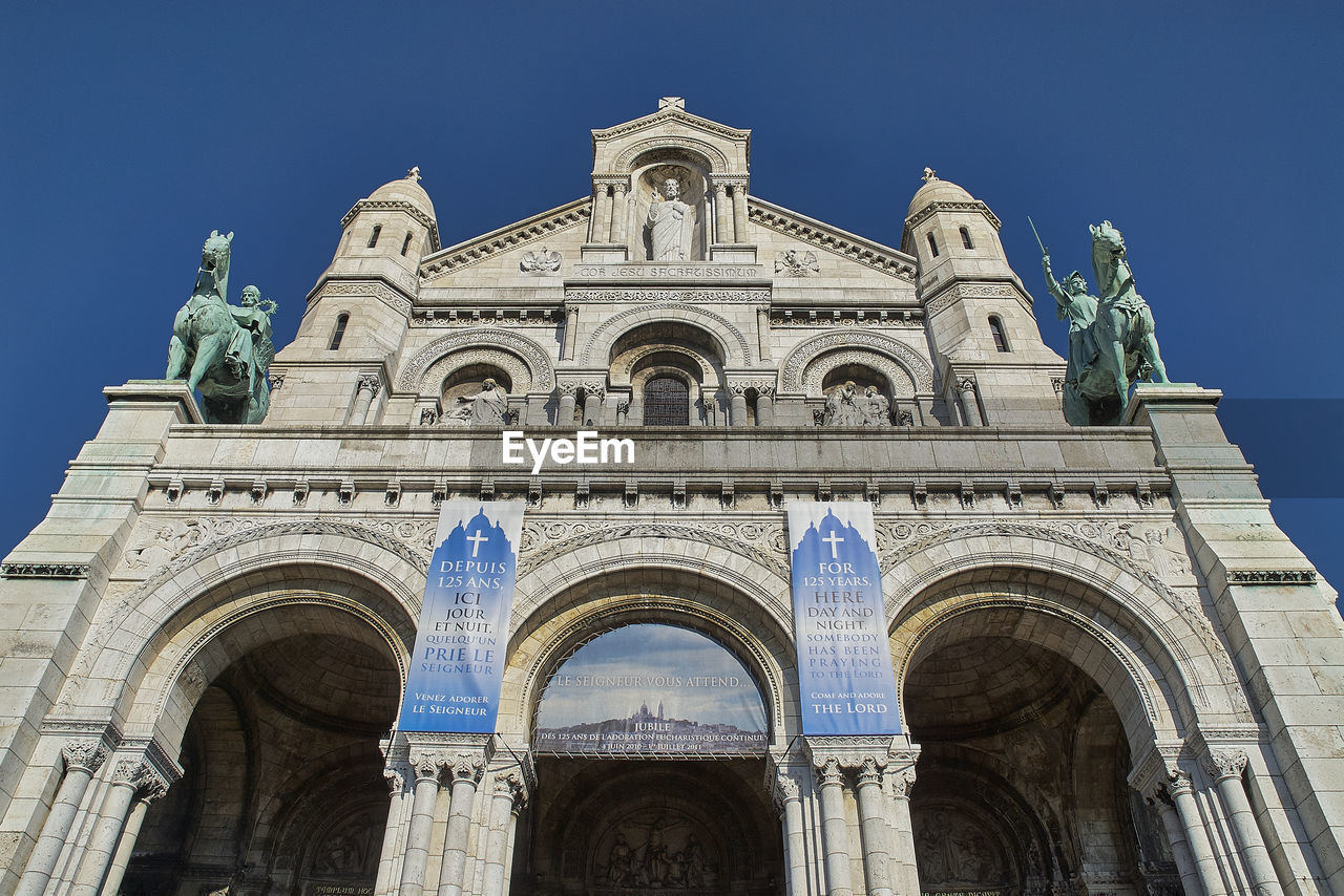 Low angle front view of sacre coeur basilica