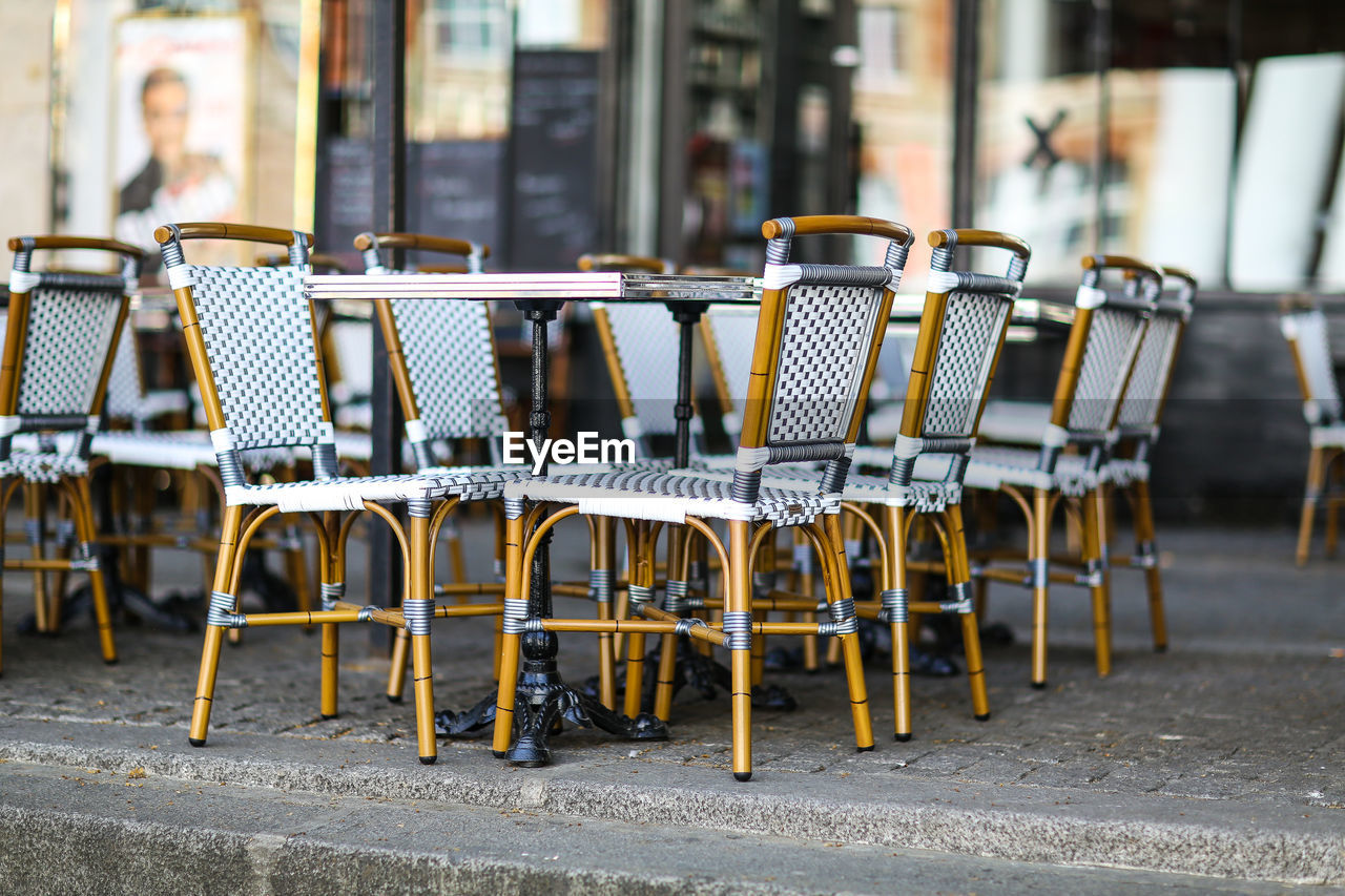 Chairs and tables at outdoor restaurant