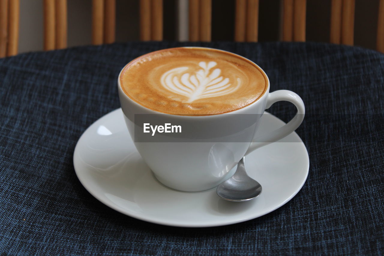 Close-up of coffee latte  on table