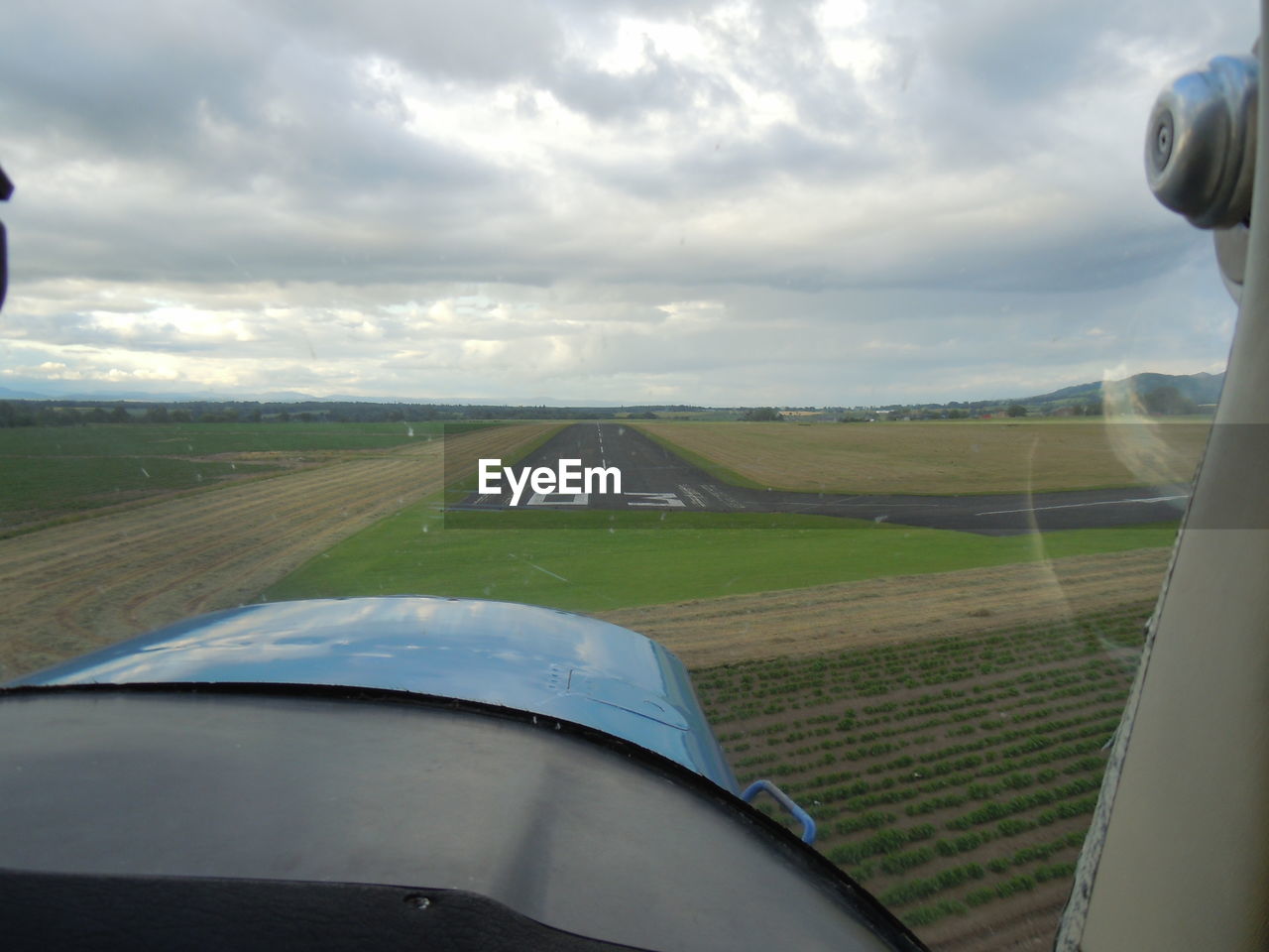 View of landscape against cloudy sky