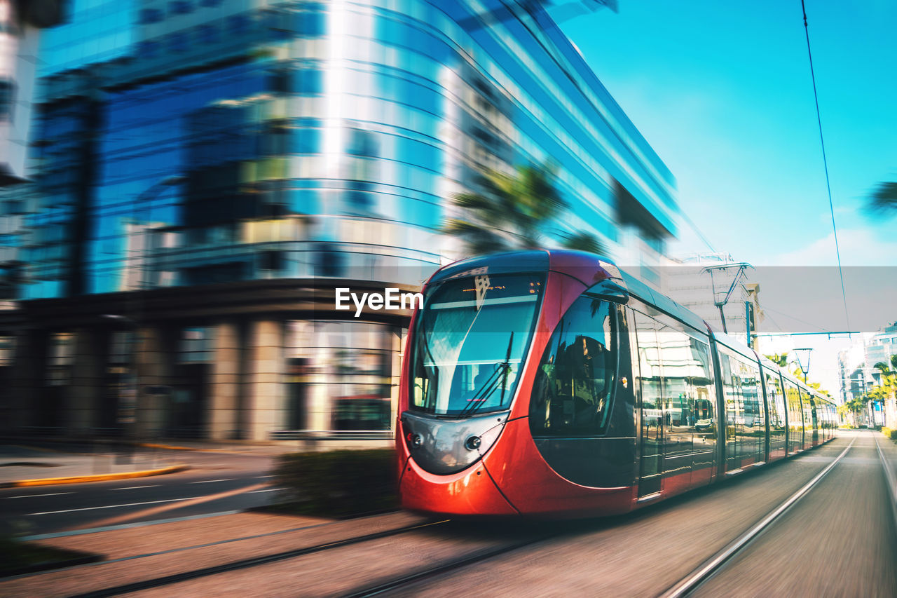 Cable car on road in city