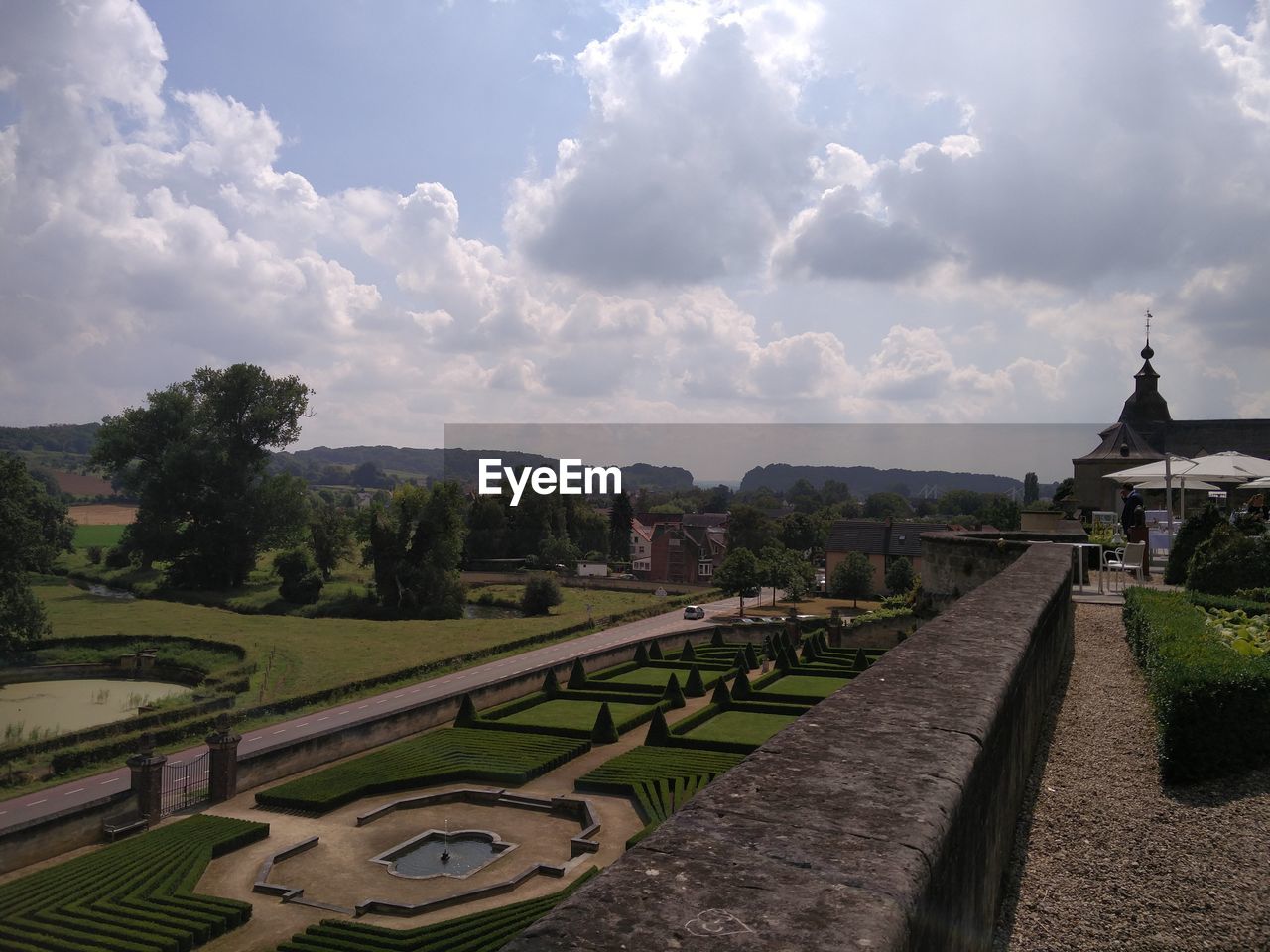 High angle view of chateau neercanne garden against cloudy sky