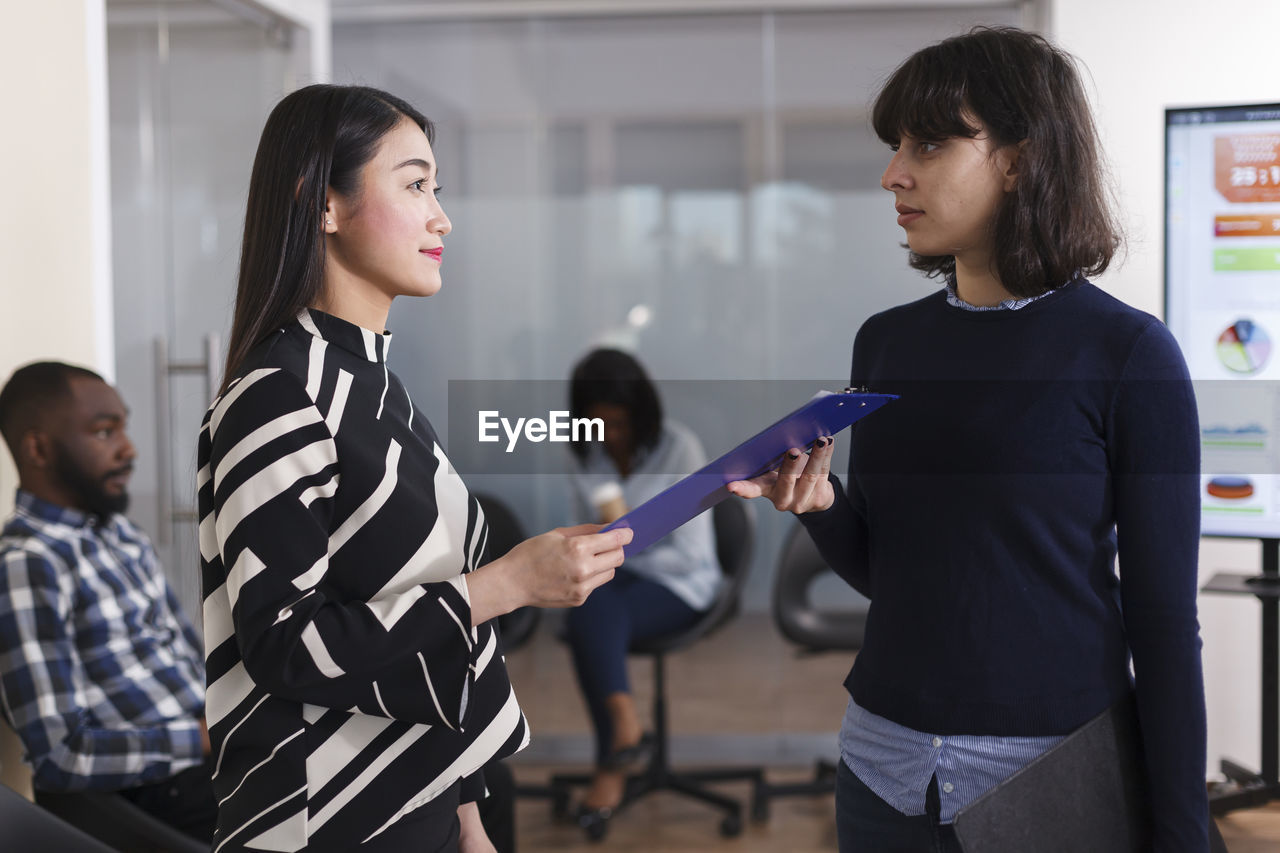 Candidate talking with interviewer at office