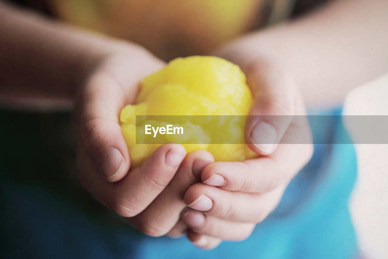 Close-up of hands holding food