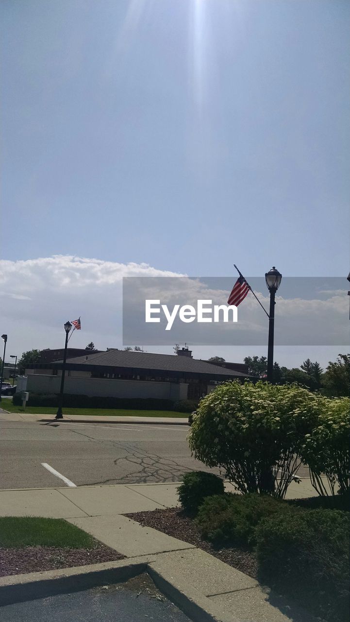 VIEW OF ROAD AGAINST CLOUDY SKY