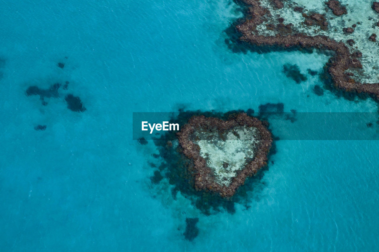 HIGH ANGLE VIEW OF HEART SHAPE MADE OF SEA