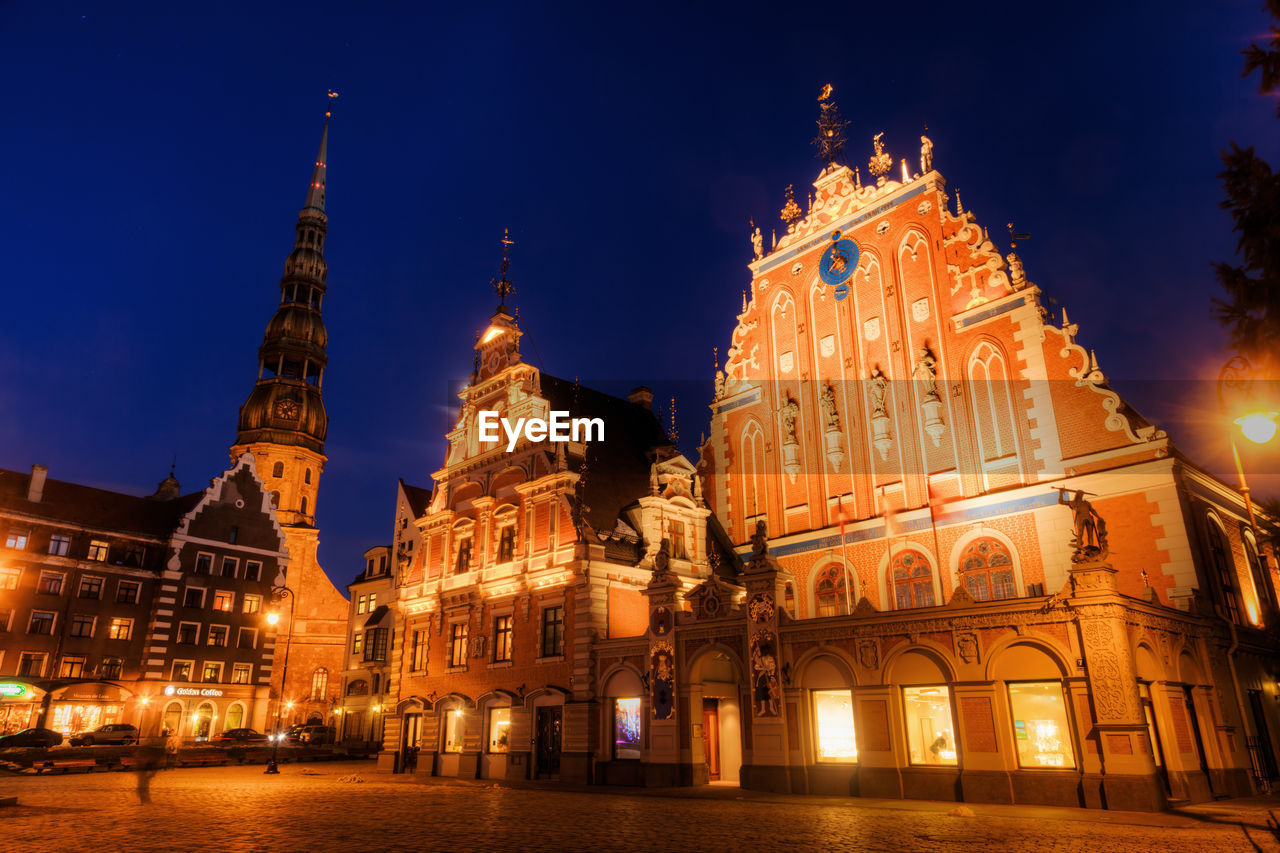 LOW ANGLE VIEW OF ILLUMINATED CATHEDRAL AGAINST SKY