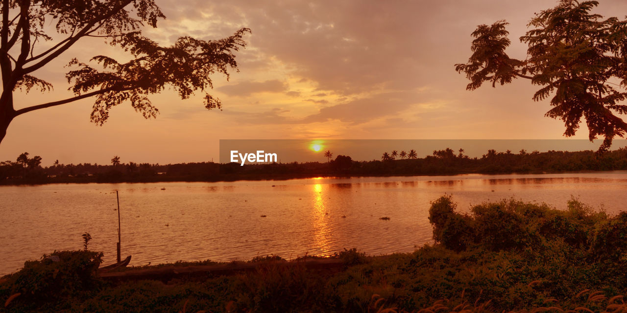 SCENIC VIEW OF LAKE DURING SUNSET