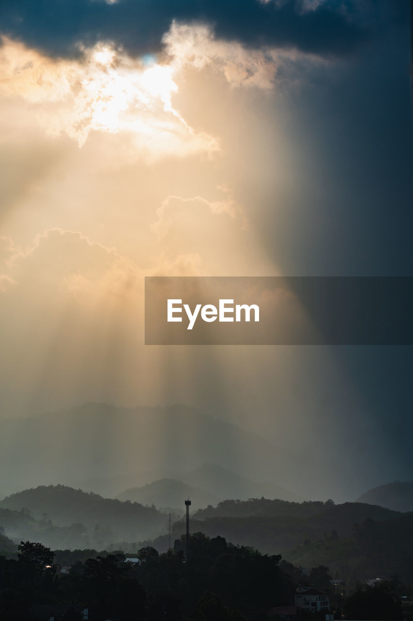 Scenic view of silhouette mountains against sky during sunset