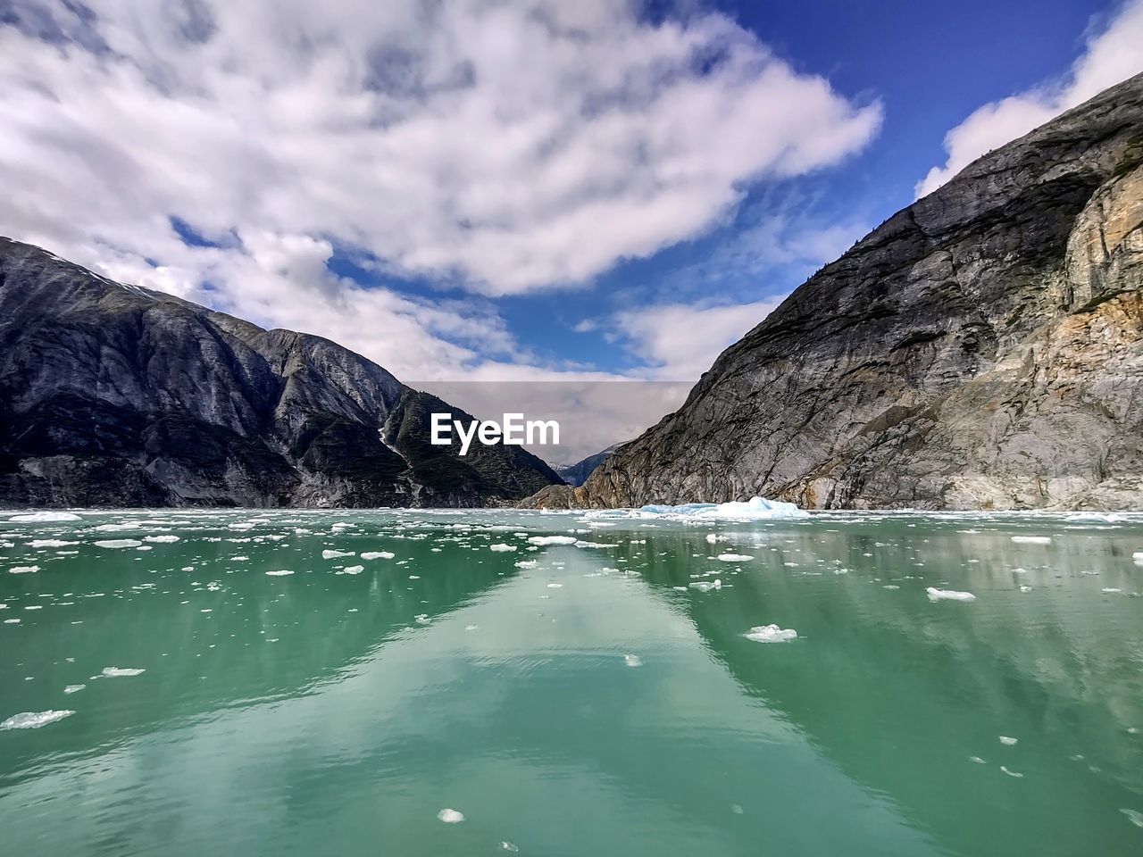 water, mountain, scenics - nature, environment, sky, beauty in nature, nature, cloud, mountain range, lake, landscape, glacial landform, land, travel destinations, travel, tranquil scene, no people, cold temperature, reflection, snow, tranquility, glacier, turquoise colored, blue, outdoors, non-urban scene, day, idyllic, tourism, ice, glacial lake, mountain peak, rock, bay, winter, tree, extreme terrain, beach, body of water