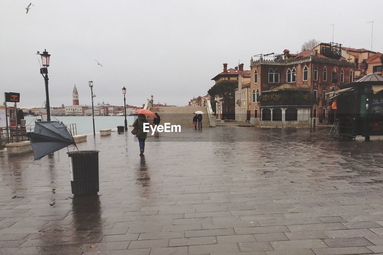 VIEW OF WET BEACH AGAINST CLEAR SKY