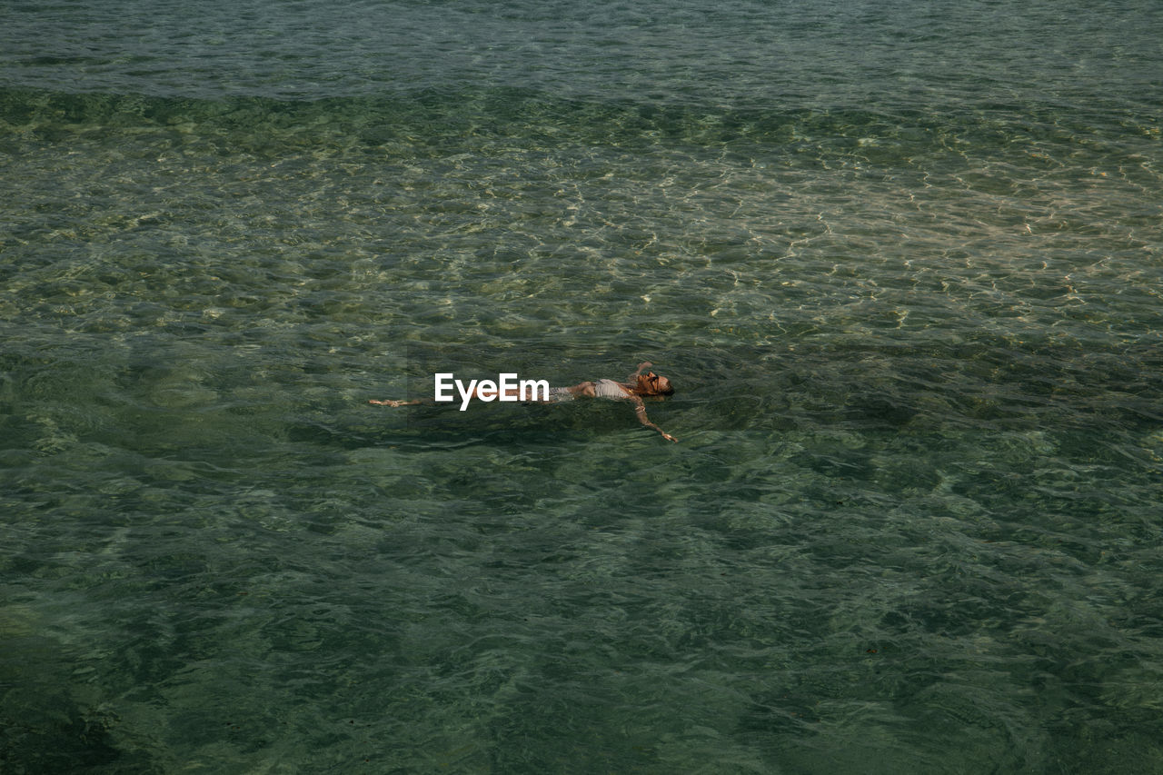 Woman swimming in sea