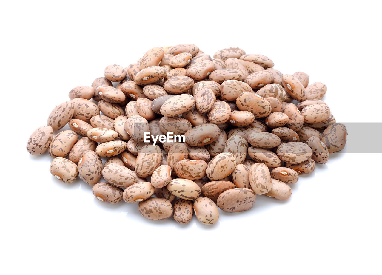 HIGH ANGLE VIEW OF BREAD AGAINST WHITE BACKGROUND