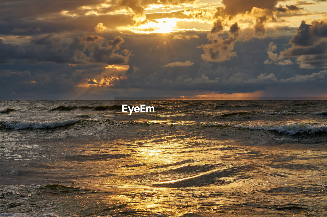 Scenic view of sea against sky during sunset