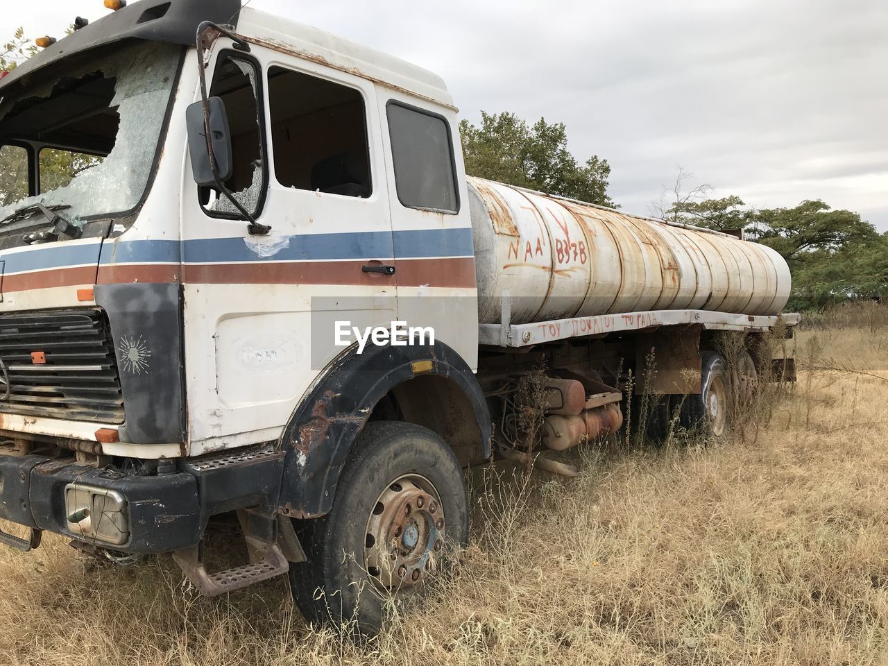 ABANDONED VEHICLE ON FIELD