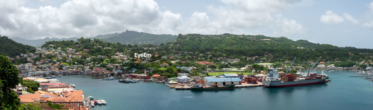 Panoramic view of townscape by sea against sky