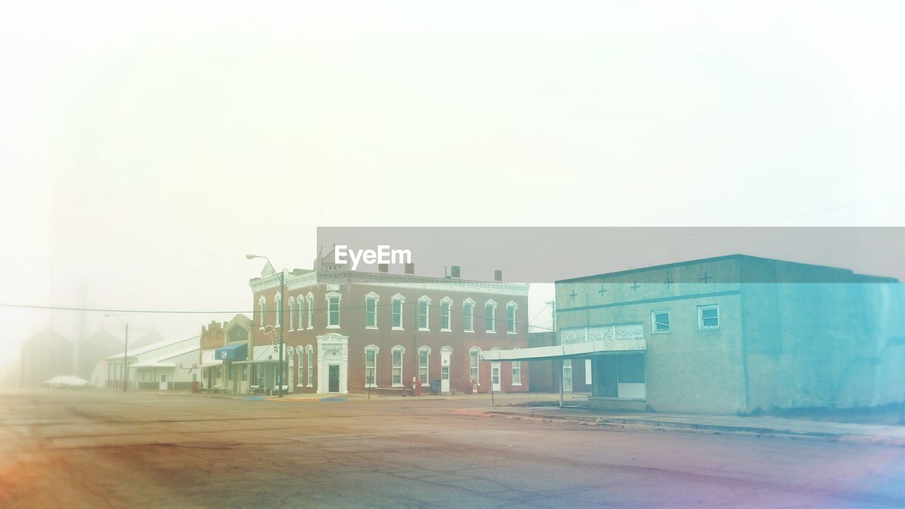 Exterior of buildings in village during foggy weather