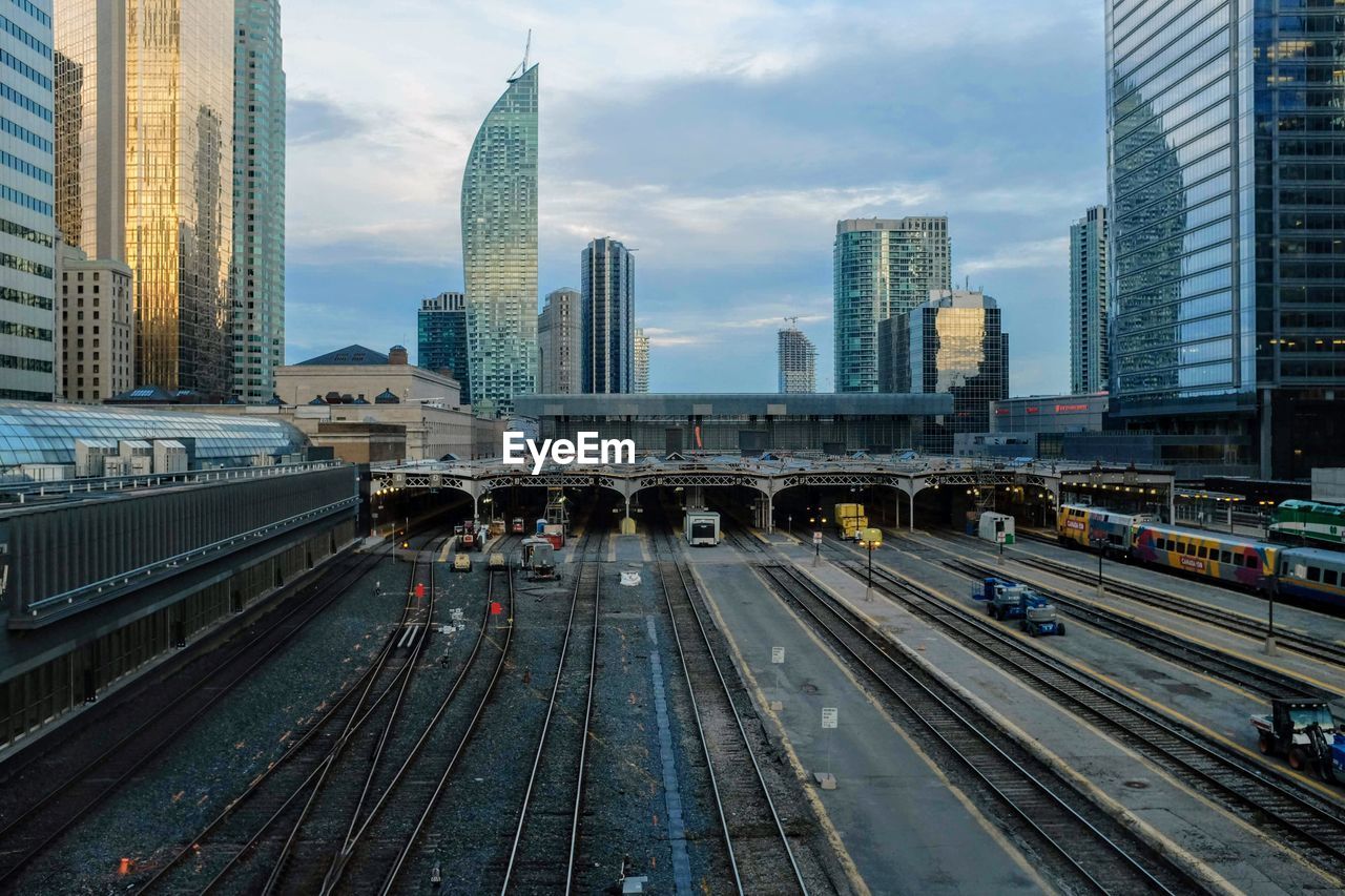 View of railroad tracks and buildings in city