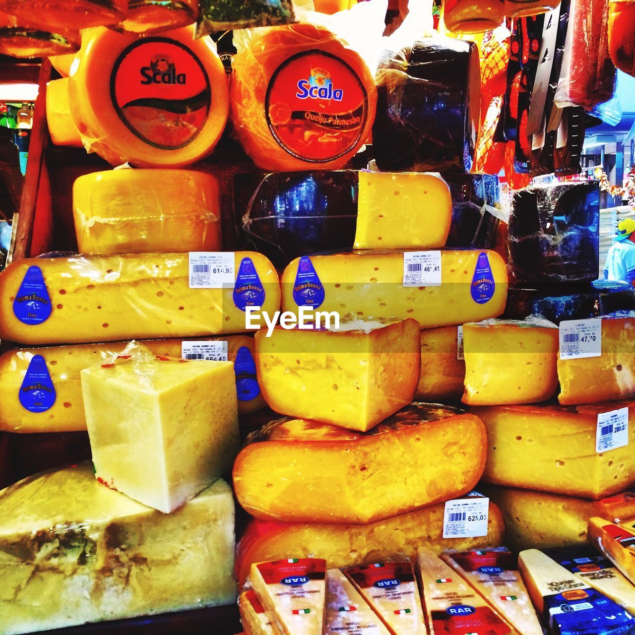 Various types of cheese for sale in market