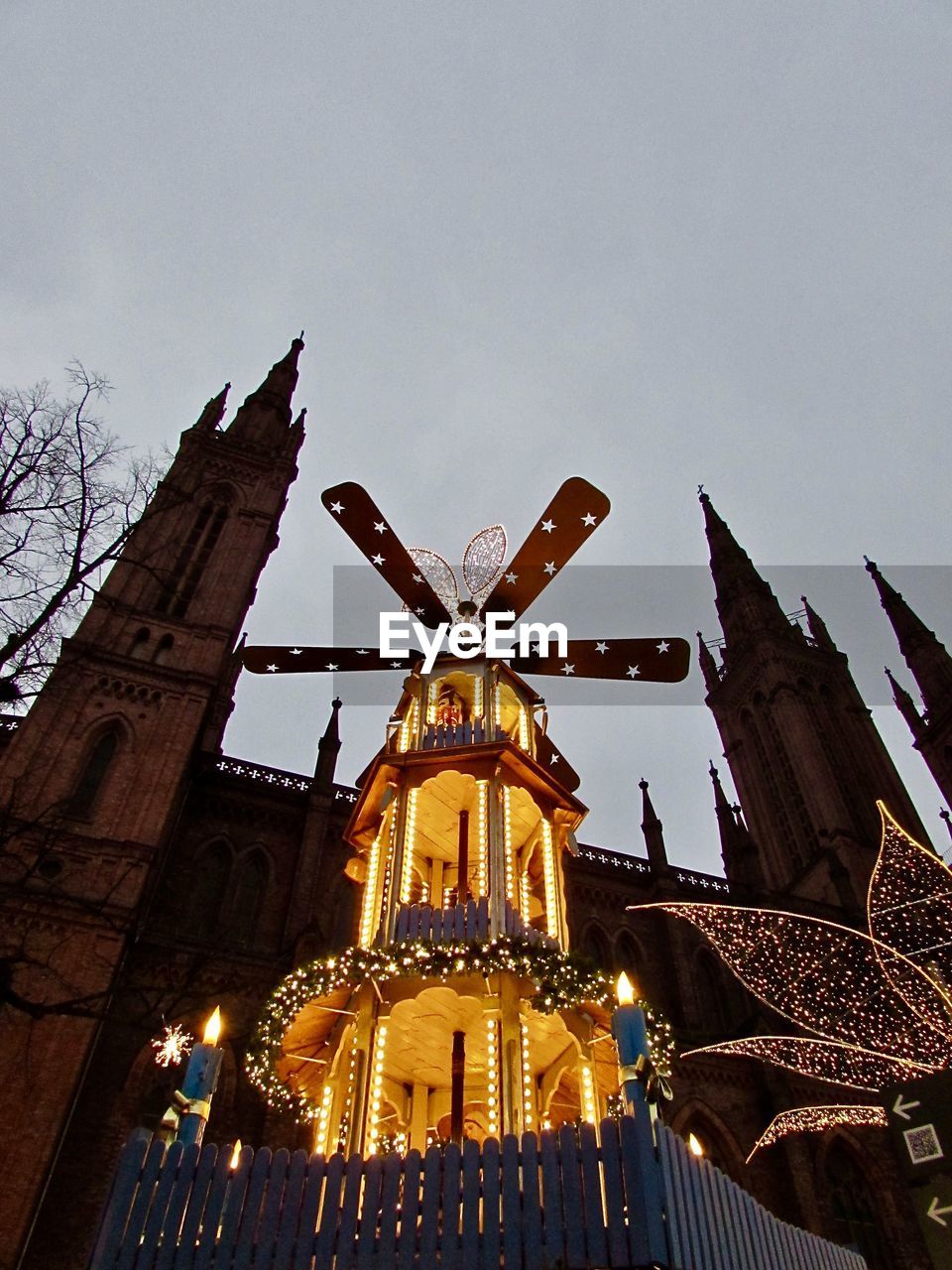 LOW ANGLE VIEW OF ILLUMINATED TEMPLE