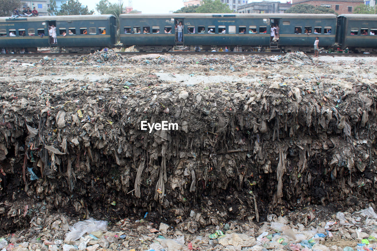 Heap of garbage by railroad tracks