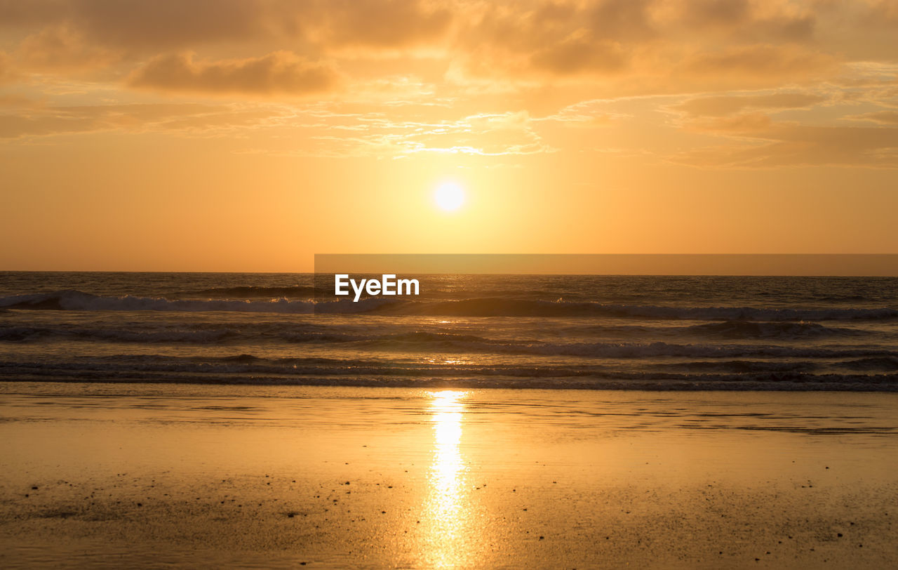 Scenic view of sea during sunset