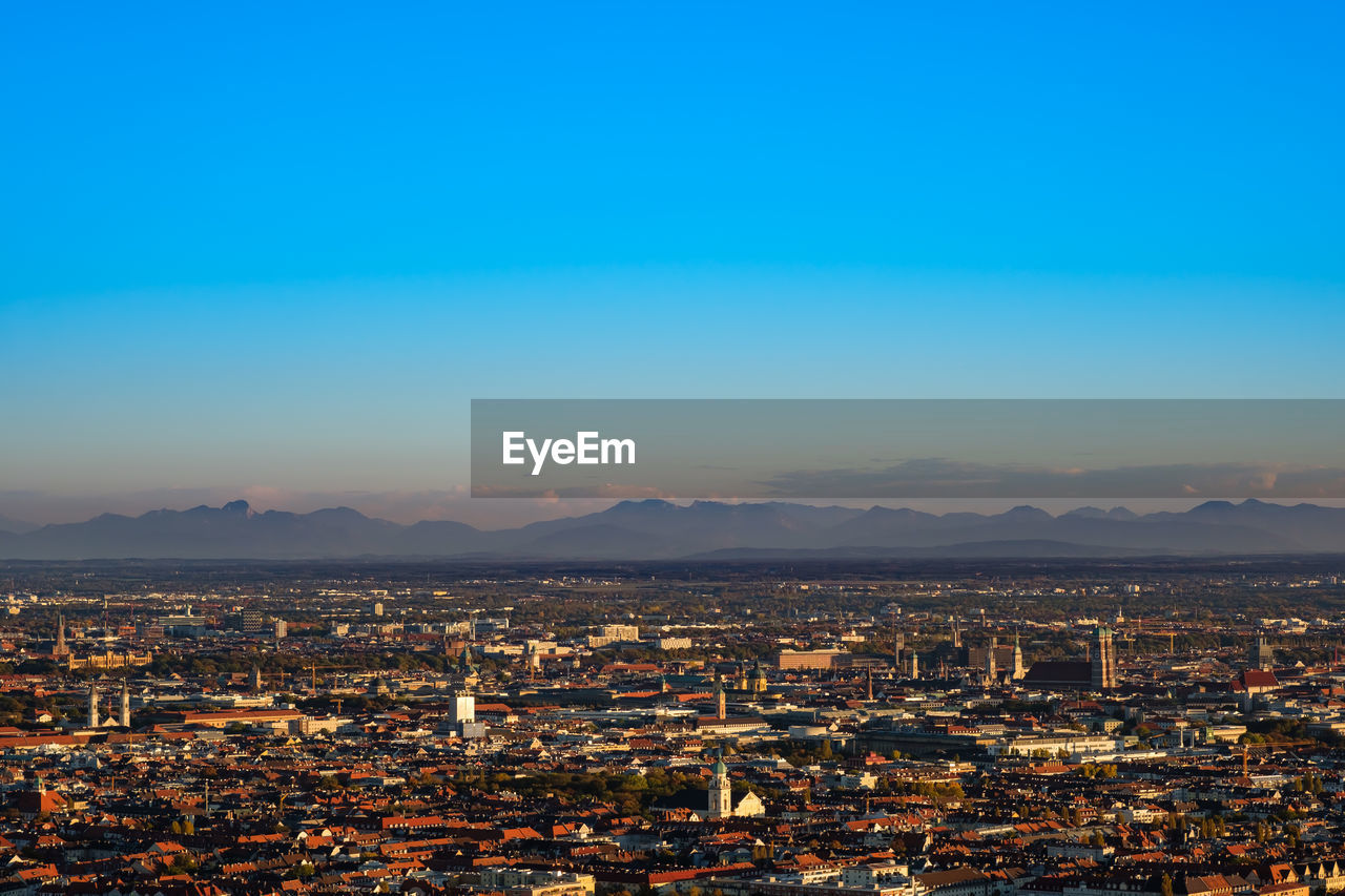 Munich panorama view with alps mountains in the evening light
