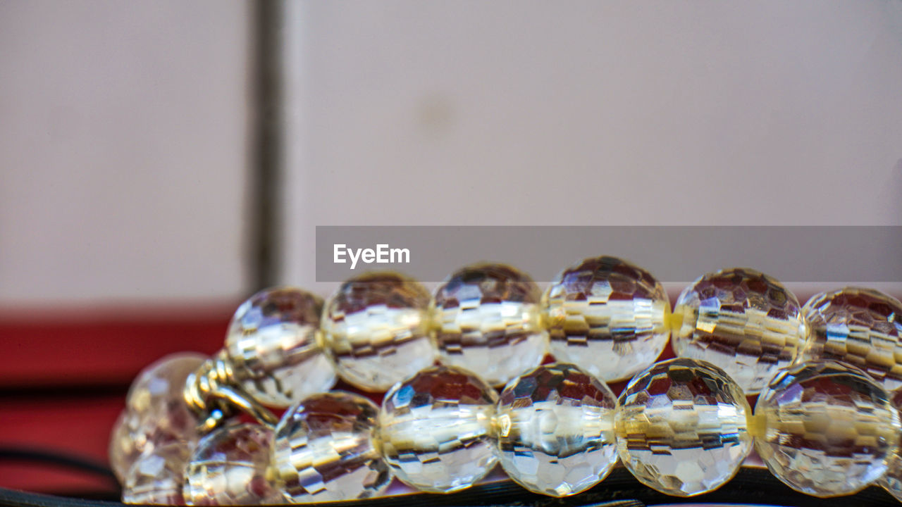 Close-up of bead on table