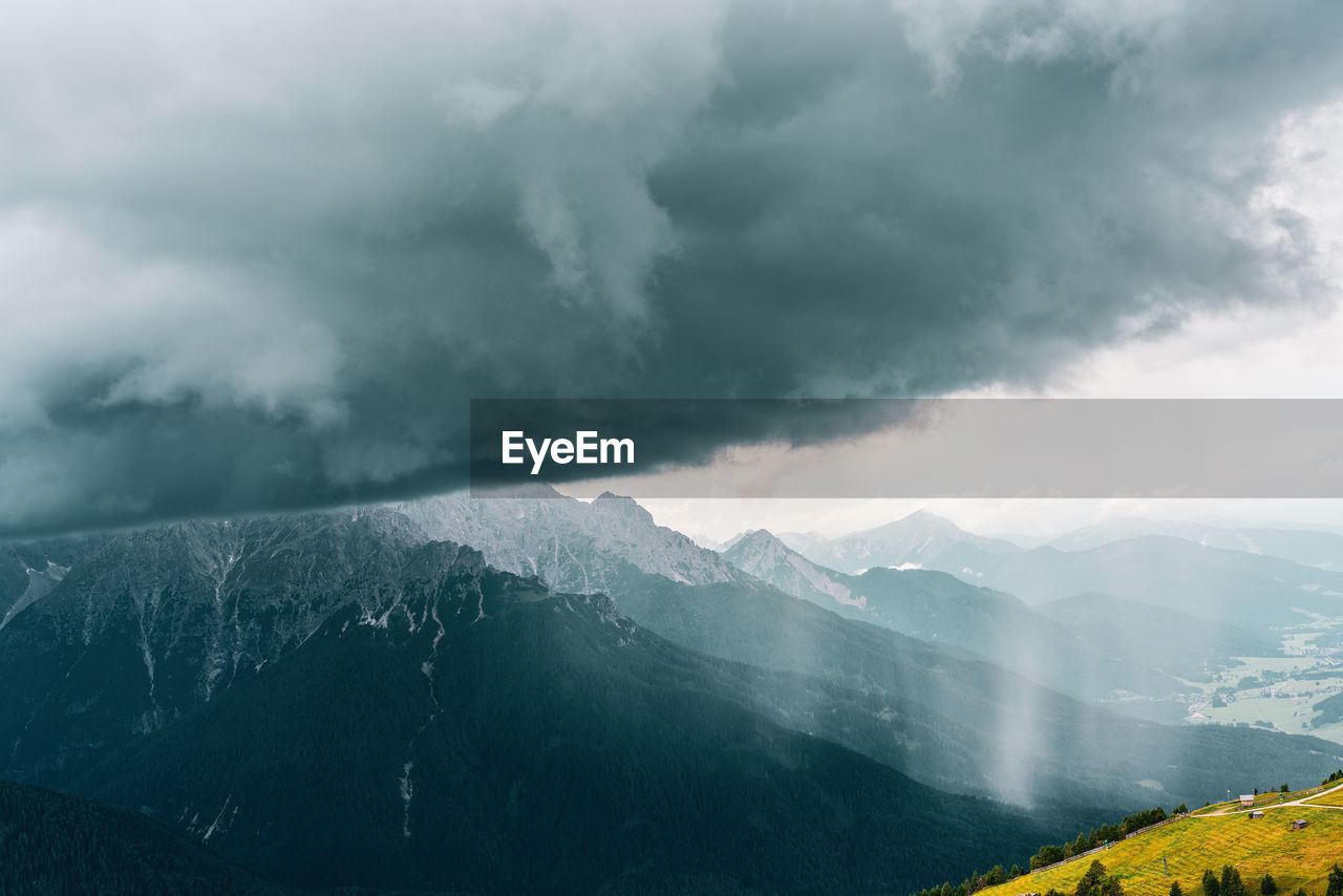 Rain wall and downpour in the sexten dolomites, italy.