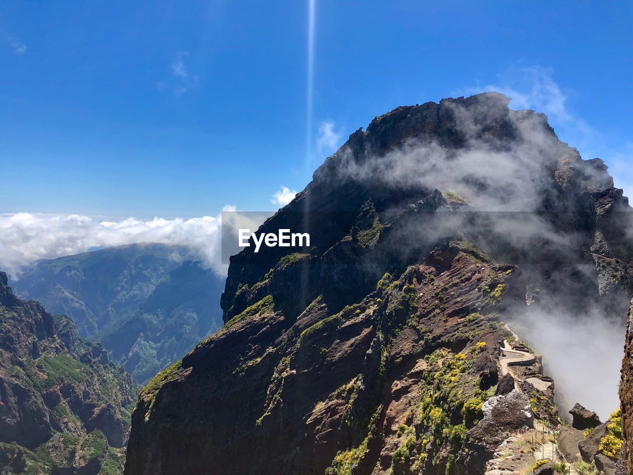 Scenic view of mountains against sky