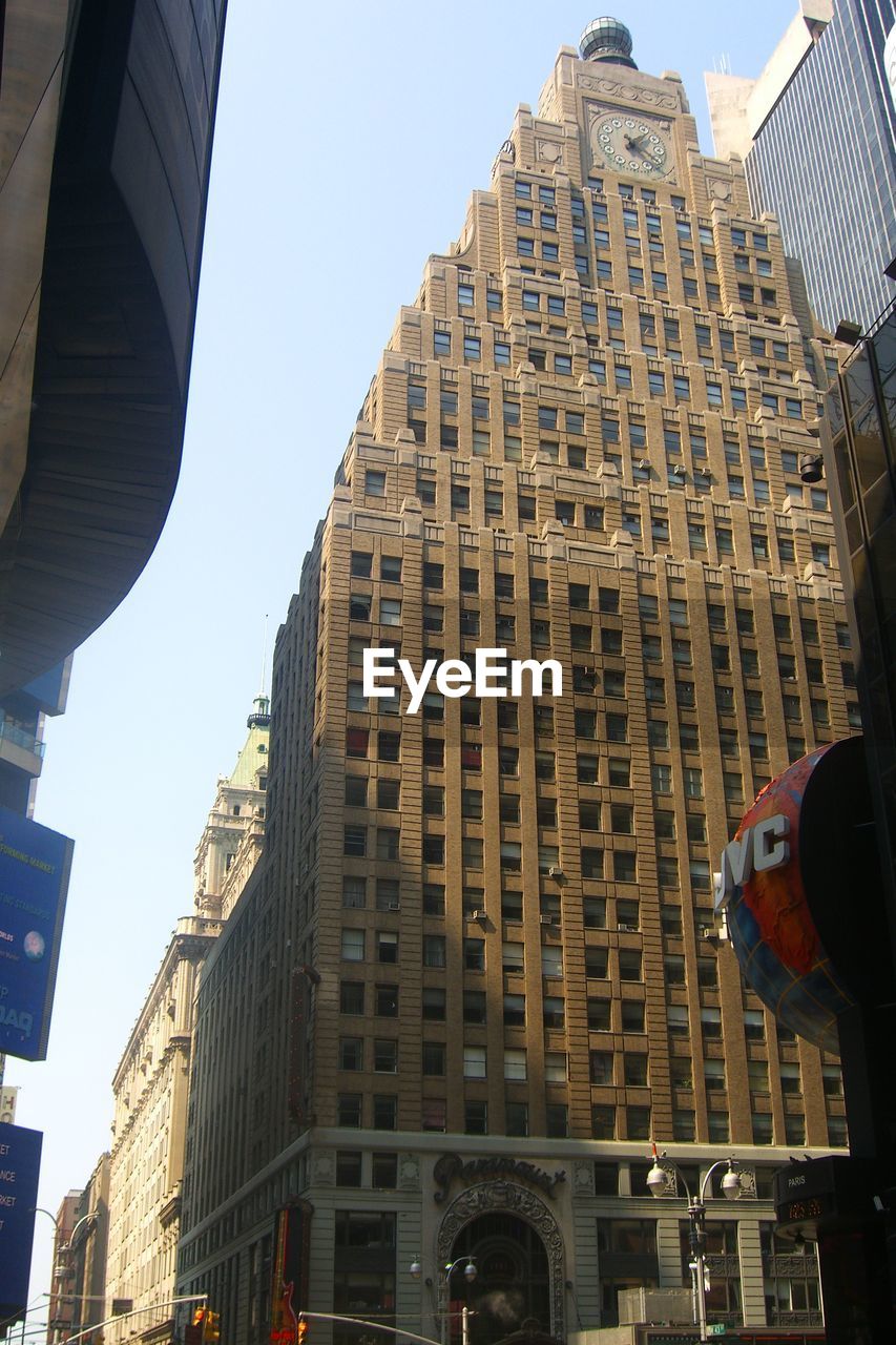 LOW ANGLE VIEW OF SKYSCRAPERS AGAINST CLEAR SKY