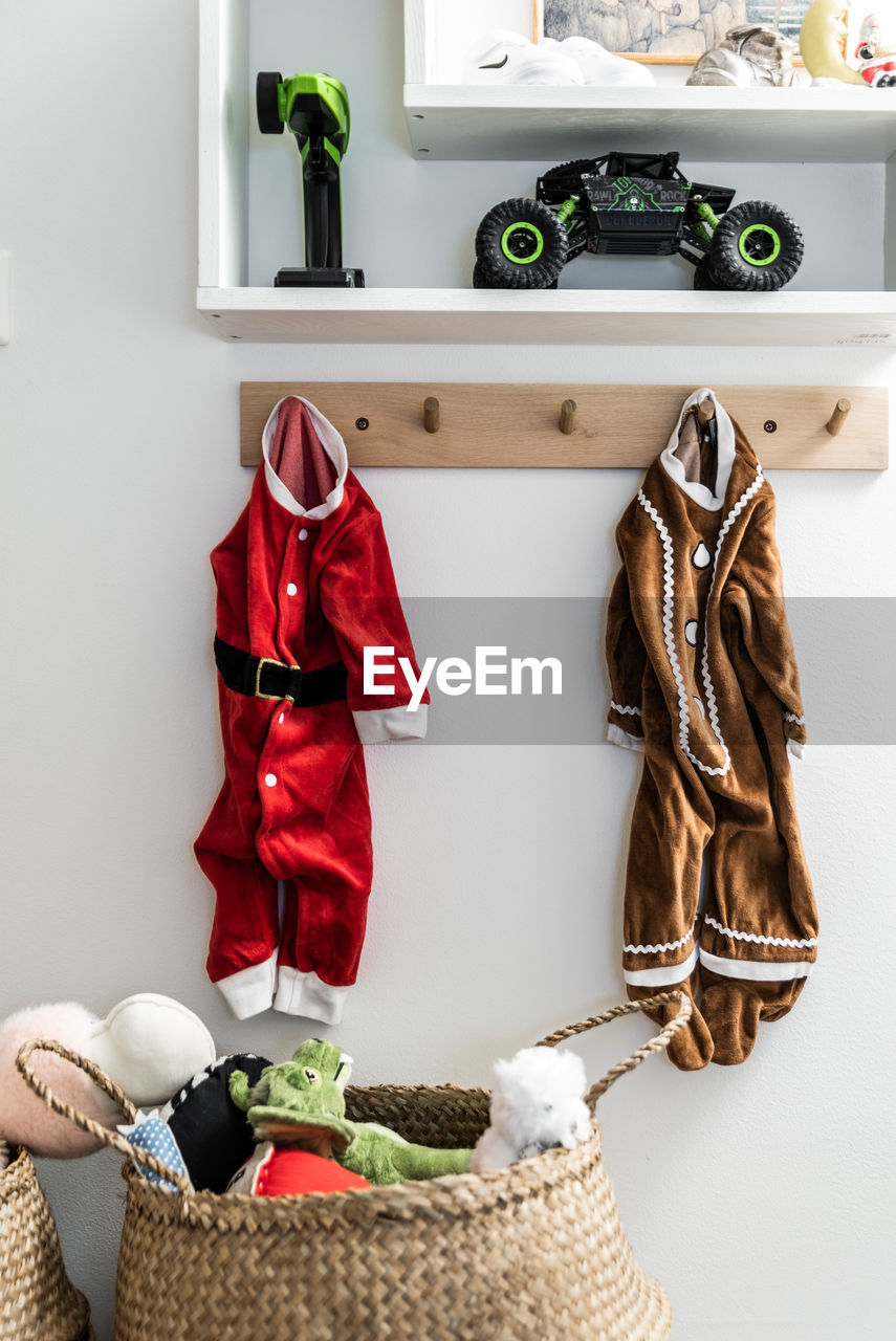 Clothes hanging over wicker basket at home