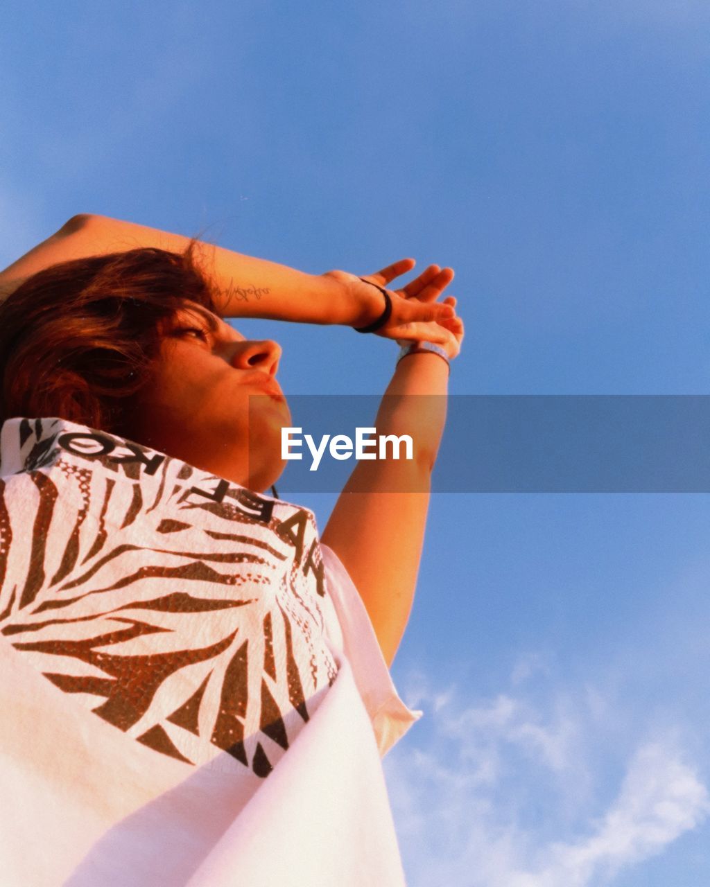 Low angle view of woman against sky