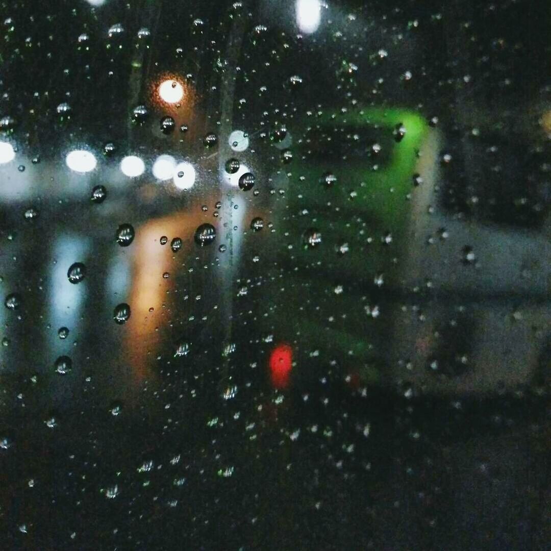 RAIN DROPS ON GLASS WINDOW