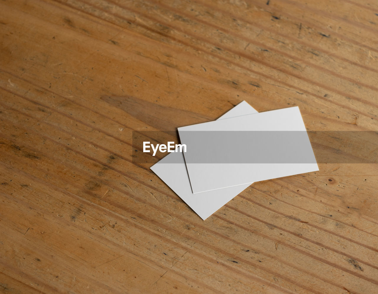 HIGH ANGLE VIEW OF PAPER ON TABLE
