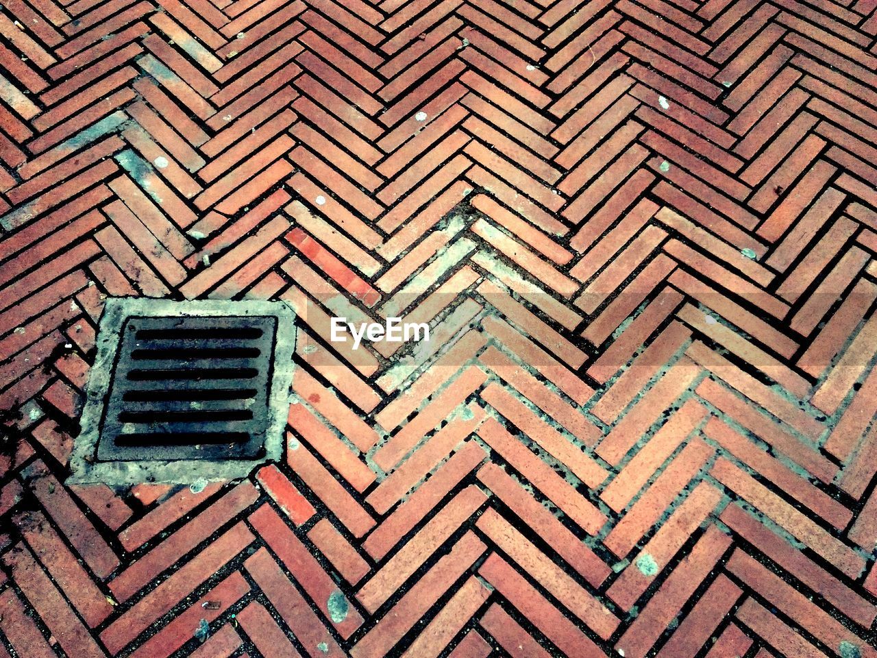 High angle view of manhole on street